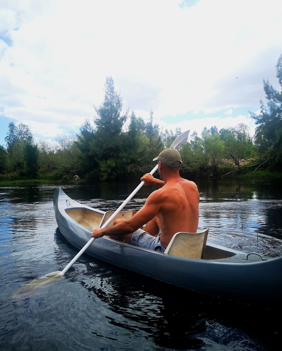 Man in canoe on river